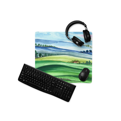Large watercolor landscape gaming mouse pad with green hills, blue sky, non-slip stitched edges