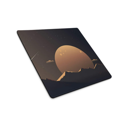 Black gaming mouse pad with golden planet over starry mountains
