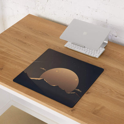 Black gaming mouse pad with golden planet over starry mountains