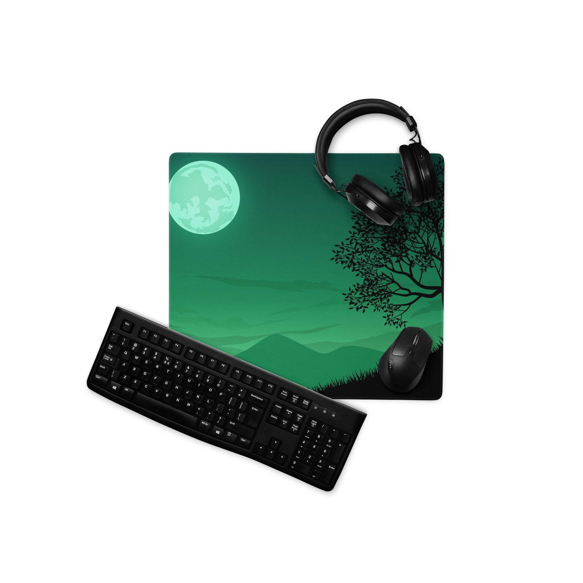 Green moonlit forest gaming mousepad with headphones and keyboard