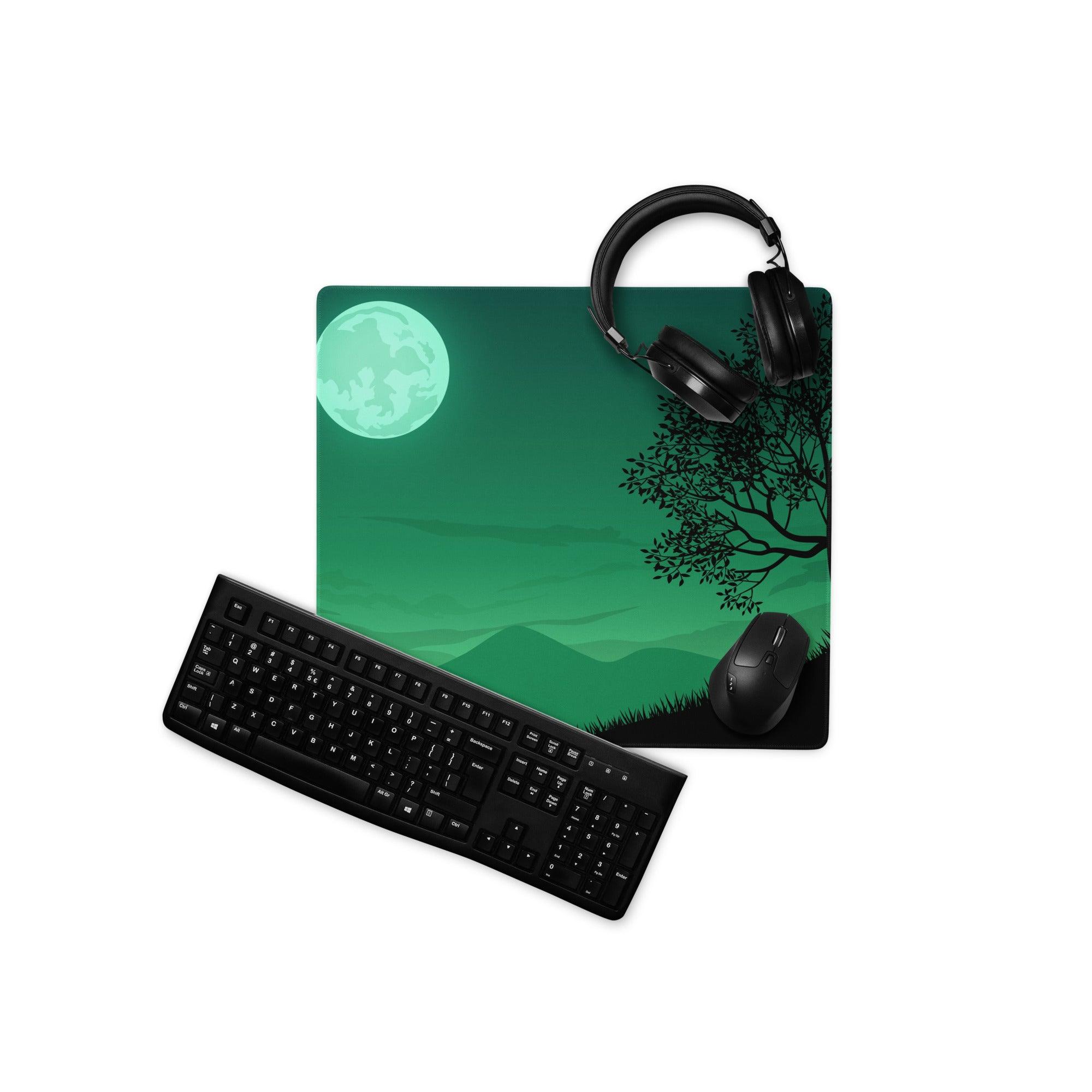 Green moonlit forest gaming mousepad with headphones and keyboard