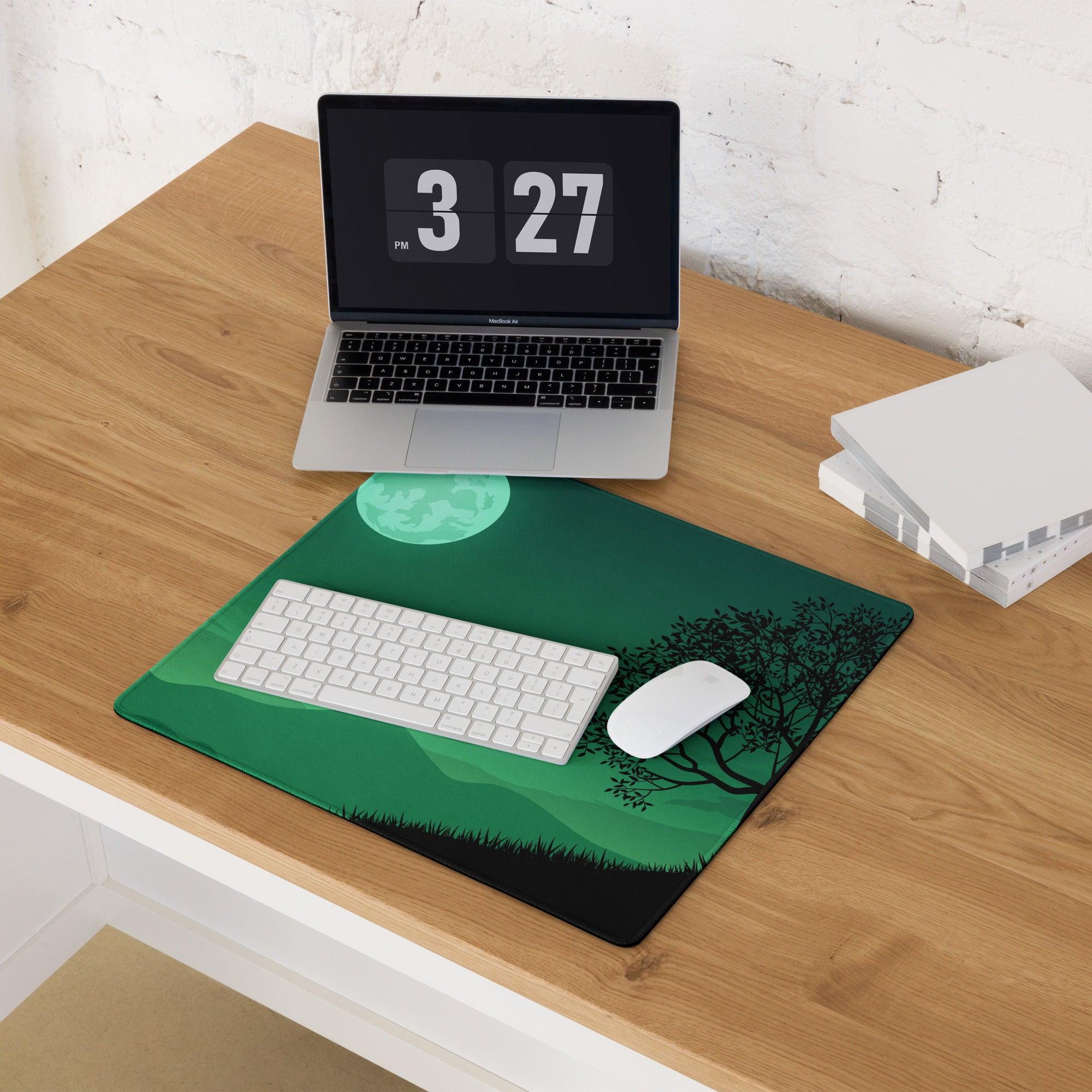 Green gaming mouse pad with black tree silhouettes, teal moon landscape, non-slip base