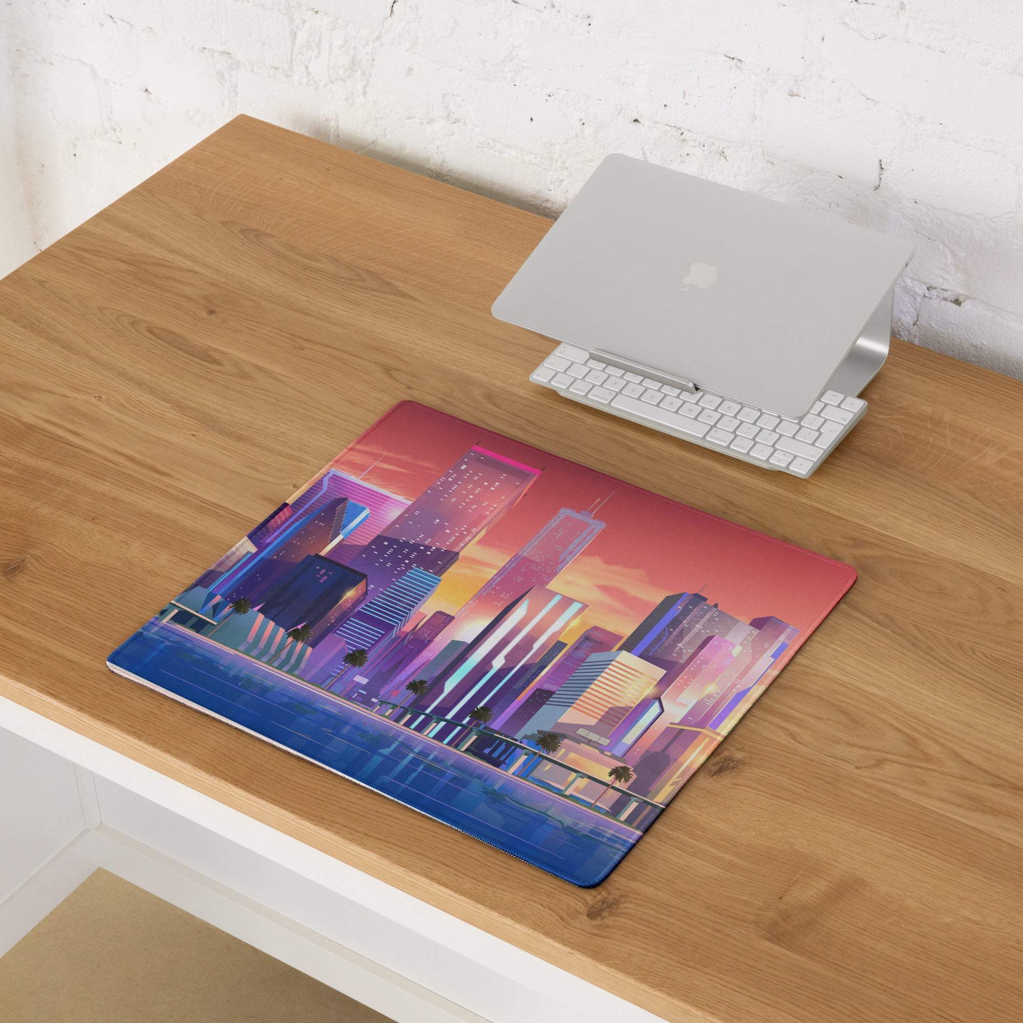 Vibrant neon purple blue cityscape laptop sleeve on large gaming mouse pad