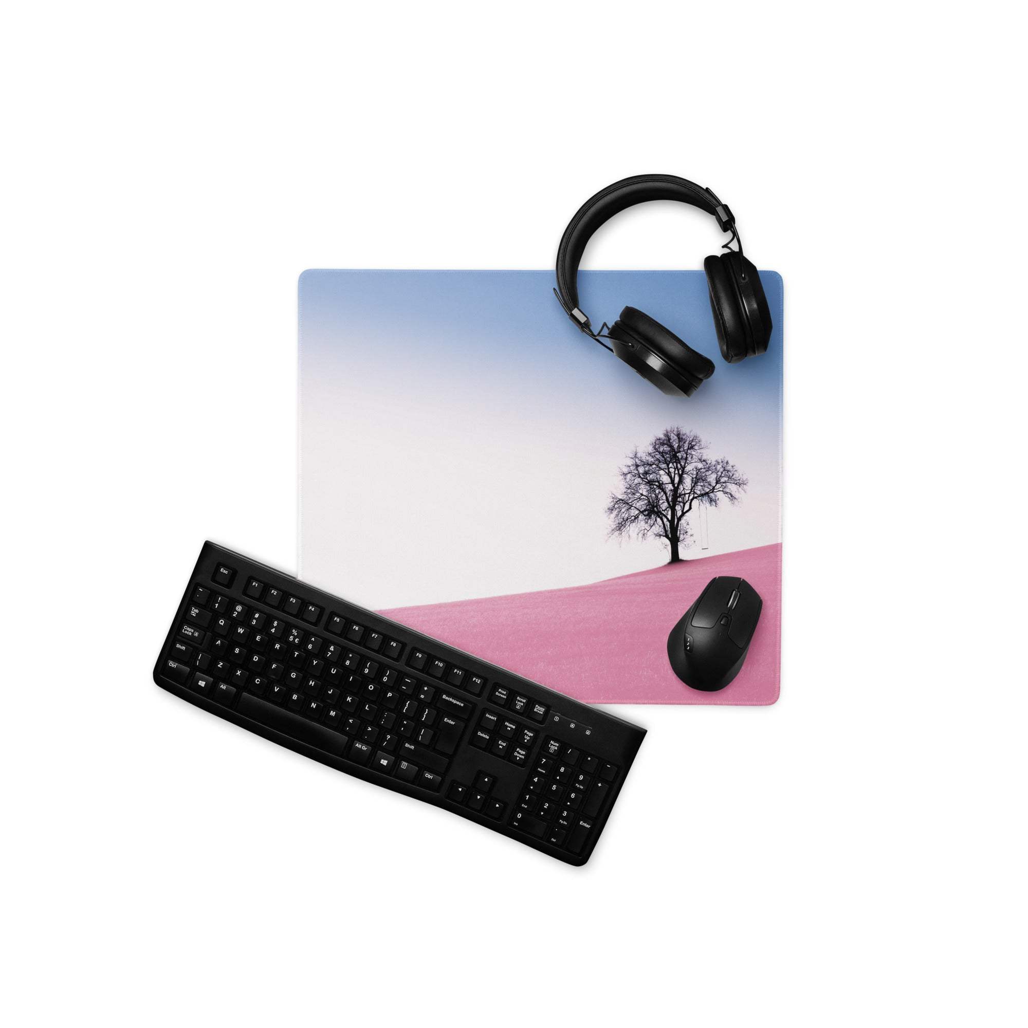 Large pastel pink landscape gaming mouse pad with gradient sky, pink hill, black tree silhouette