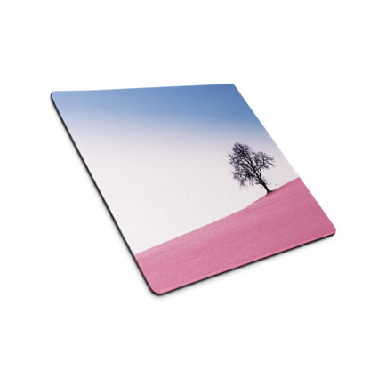 Large pastel pink landscape gaming mouse pad with black tree silhouette