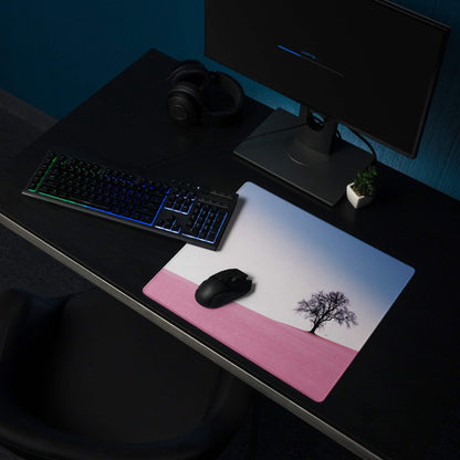 Large pastel pink gradient landscape gaming mouse pad with tree silhouette