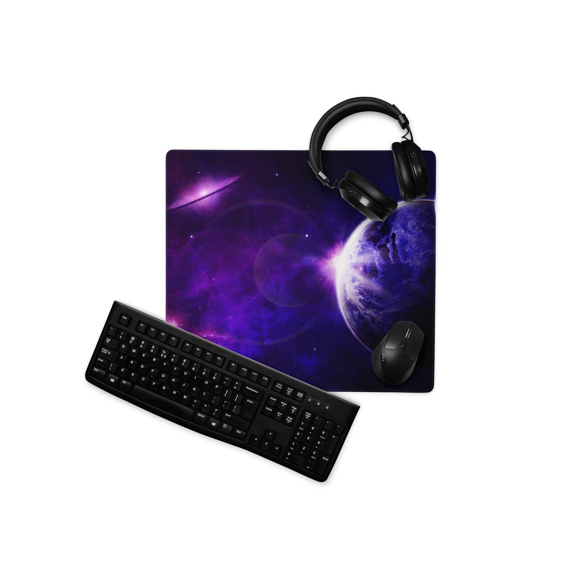 Purple galaxy mousepad with planet nebula design, headphones on top