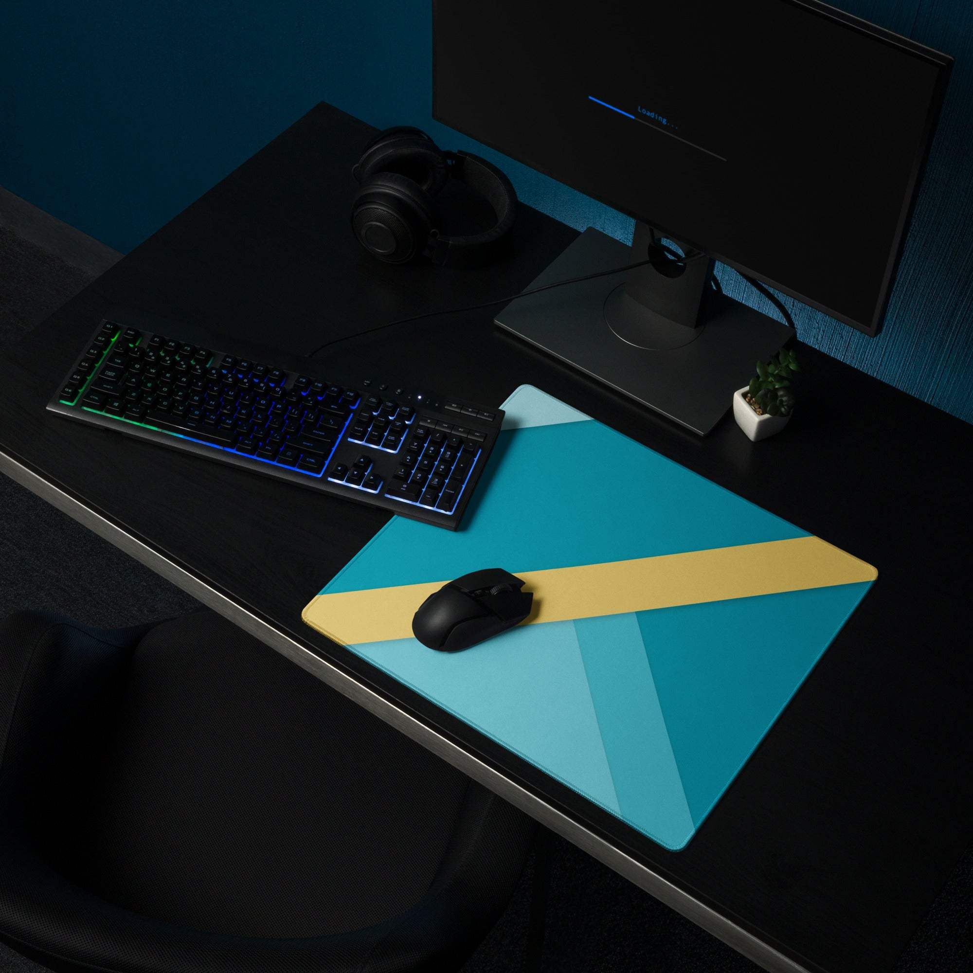 Geometric teal and yellow gaming mouse pad with non-slip base and stitched edges