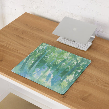 Watercolor forest green blue gaming mouse pad on wooden desk