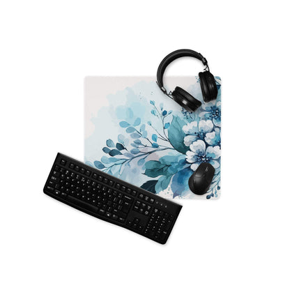 Blue watercolor floral gaming mousepad with black keyboard and headphones
