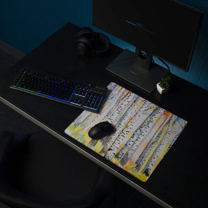 Watercolor birch forest pastel gaming mouse pad with non-slip surface on dark desk
