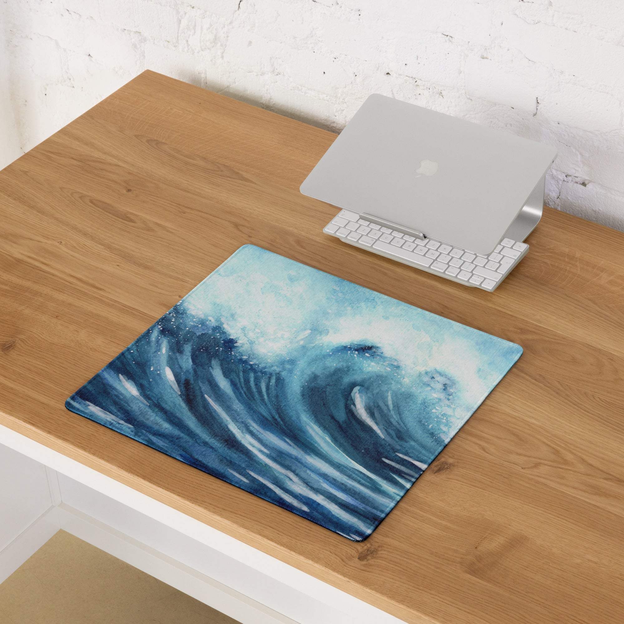 Blue watercolor ocean wave gaming mouse pad with stitching and non-slip backing