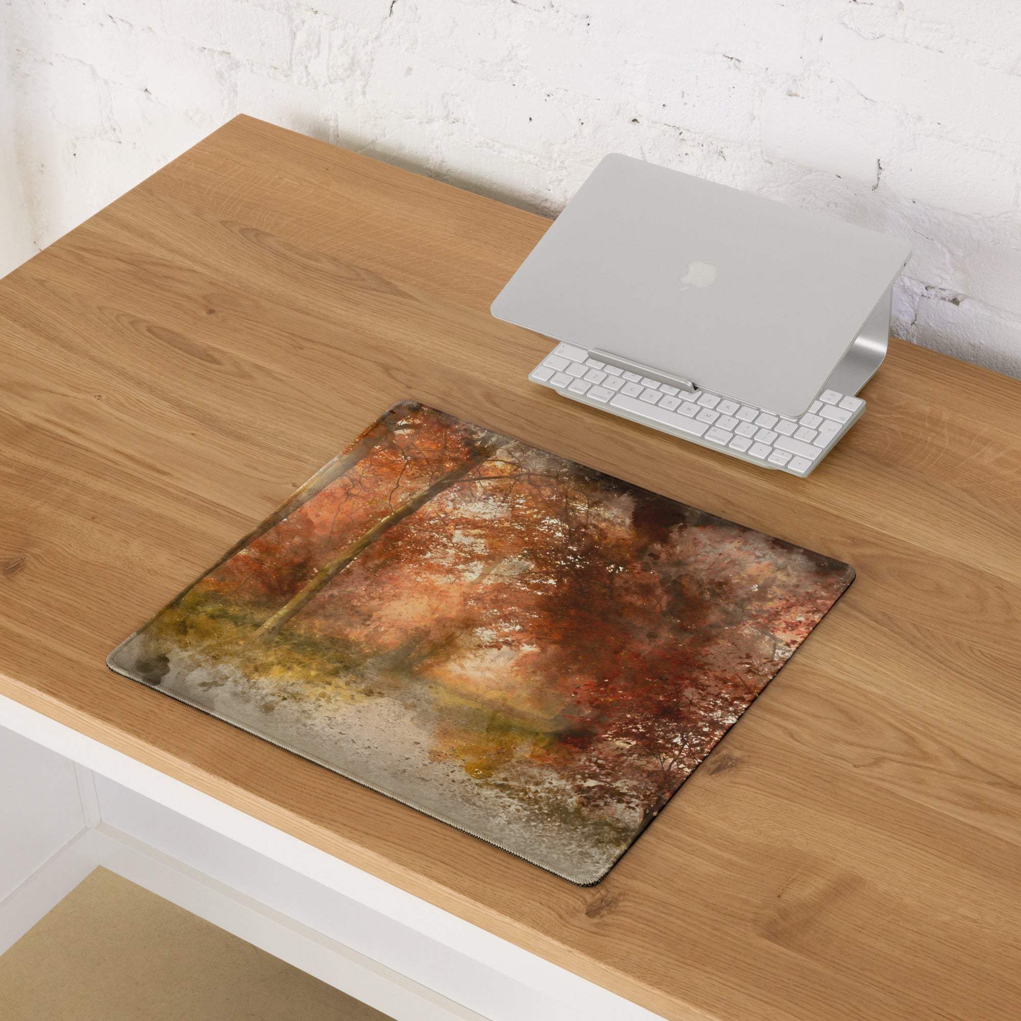 Large watercolor autumn forest path gaming mouse pad with warm browns, oranges, non-slip base