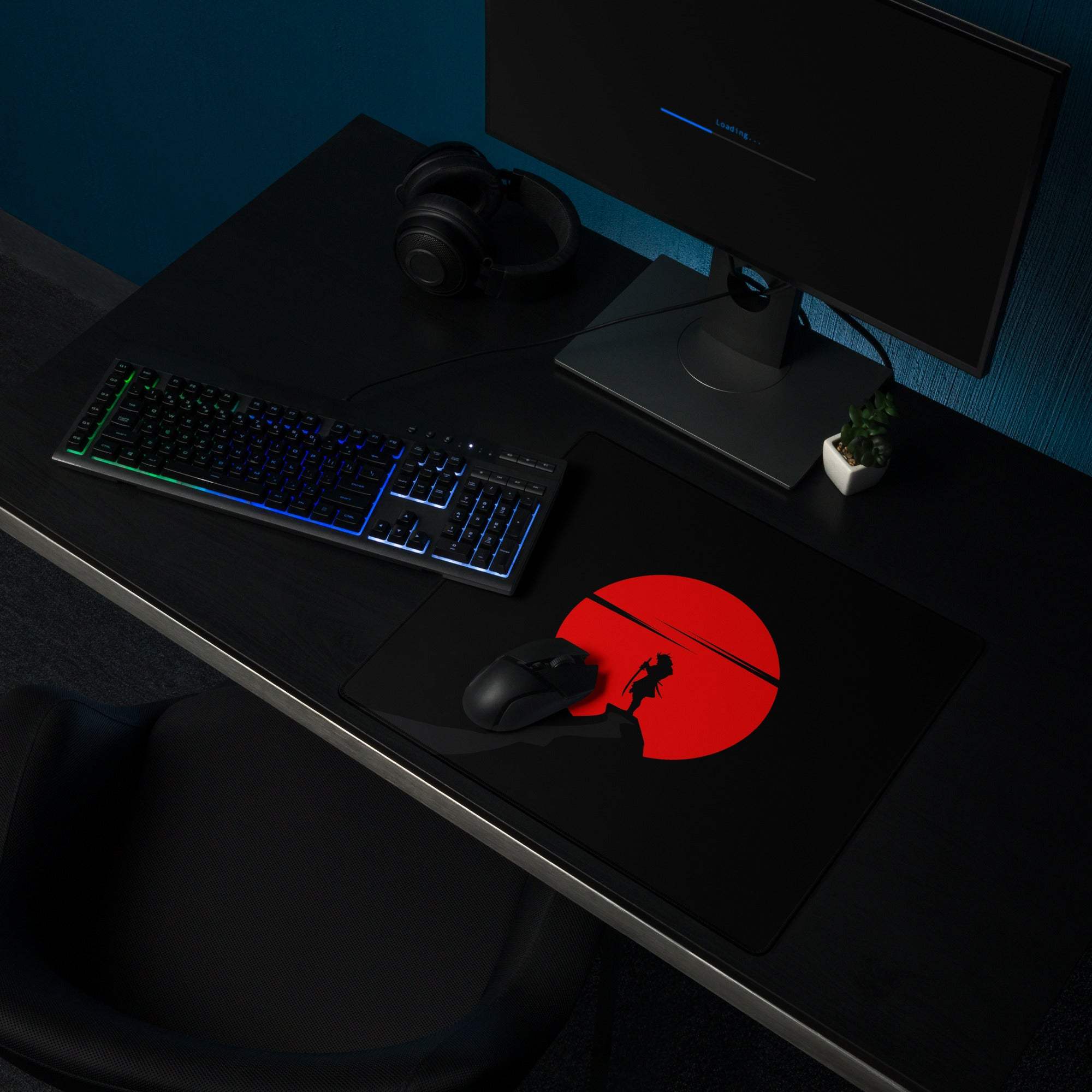 Large black gaming mouse pad with red sun silhouette design, non-slip base