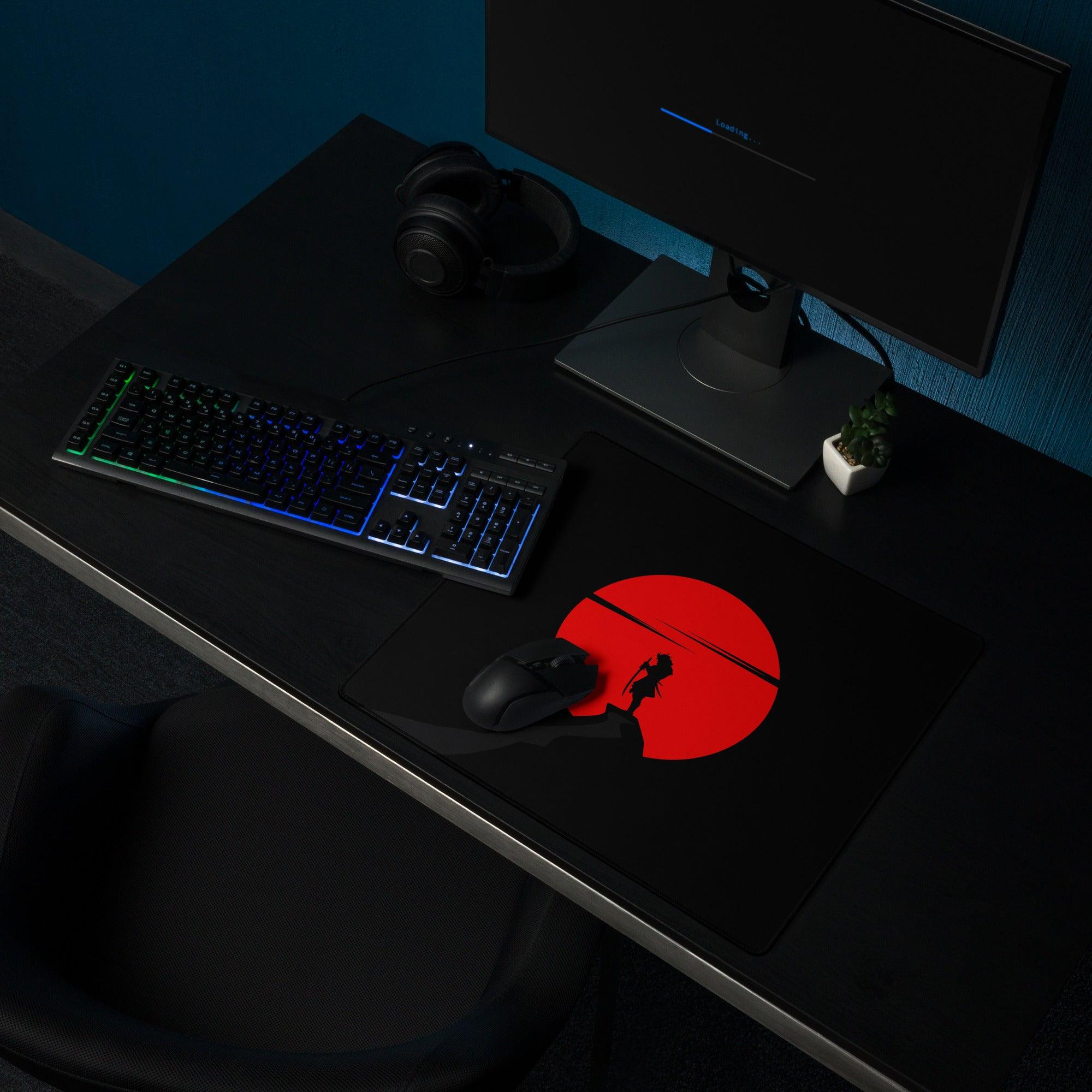 Large black gaming mouse pad with red sun silhouette design, non-slip base