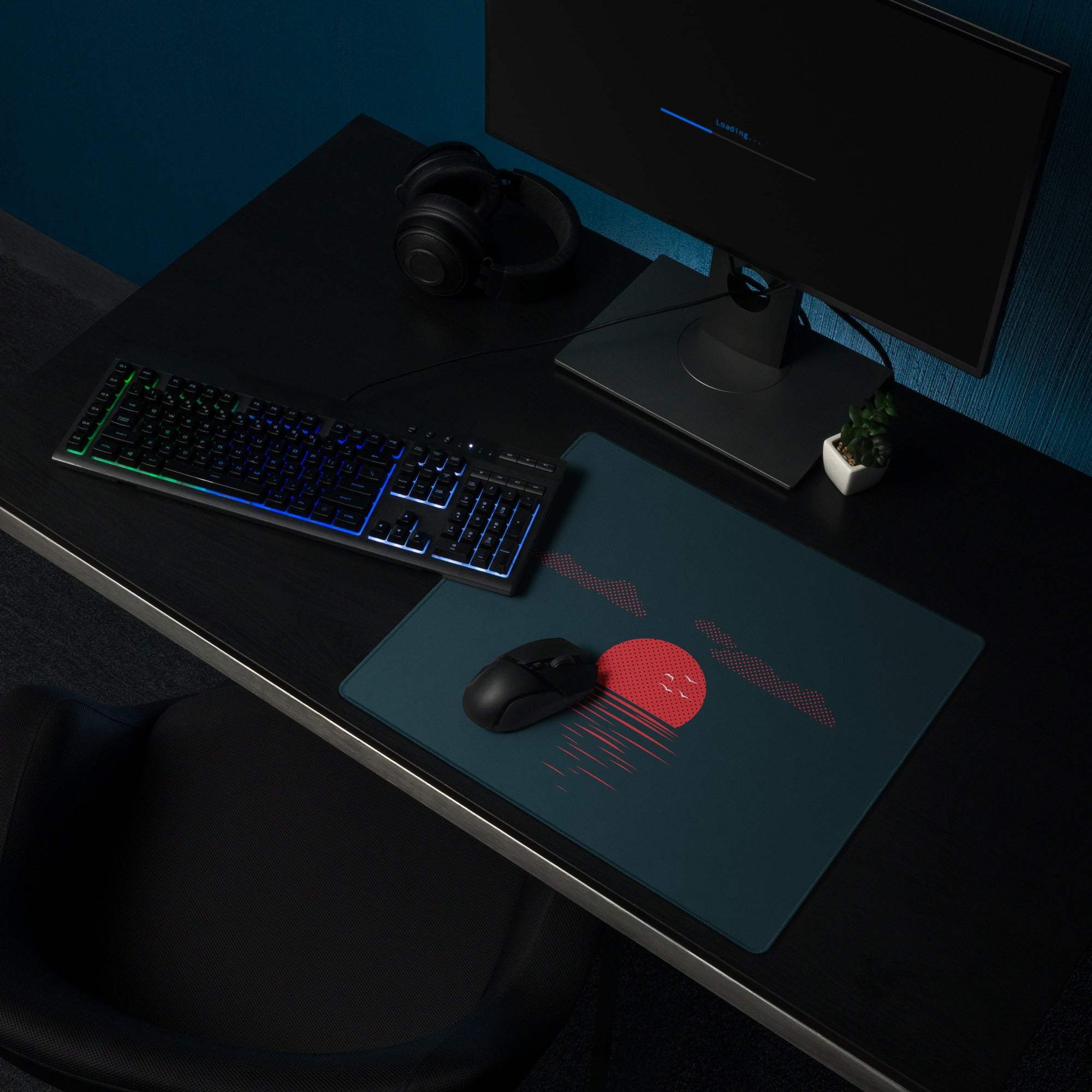 Teal gaming mousepad with red sun, pink dotted rays on dark navy, non-slip base