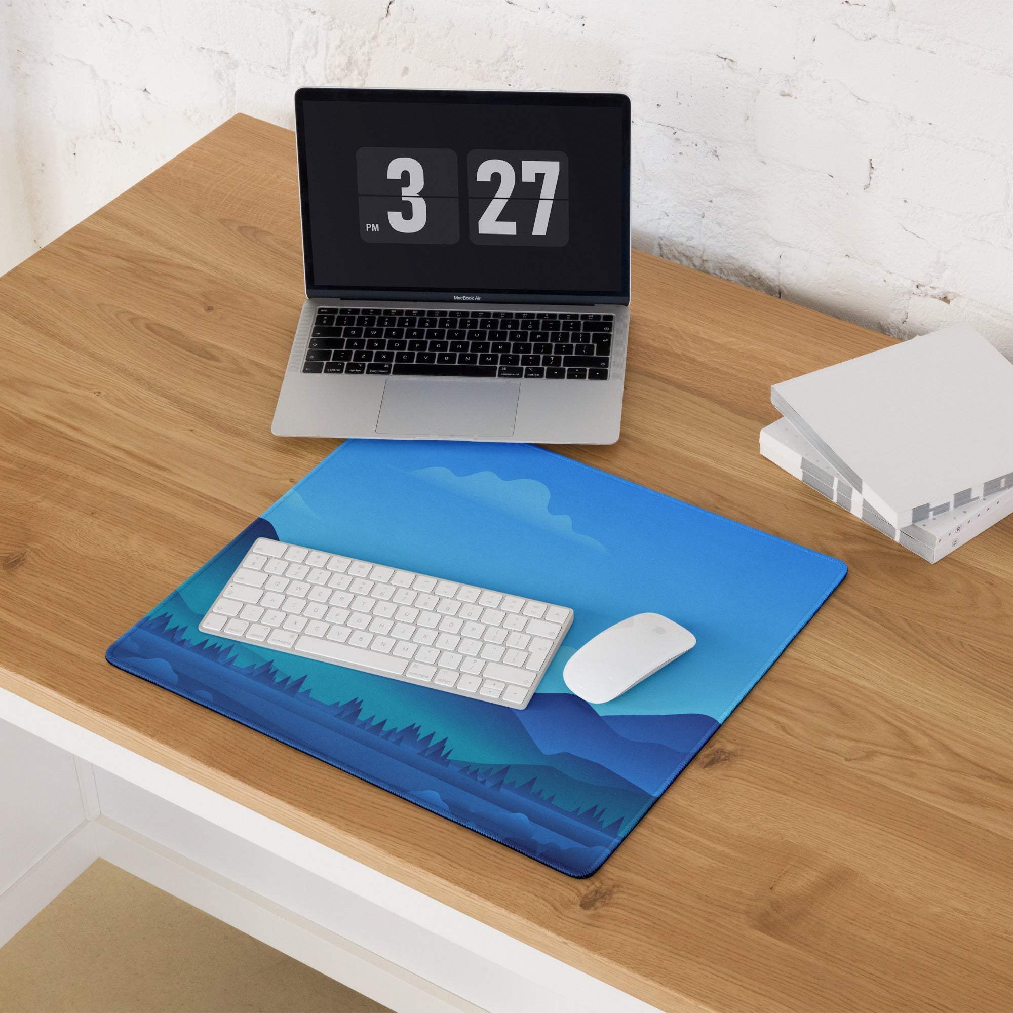 Blue mountain landscape gaming mousepad with white keyboard and mouse