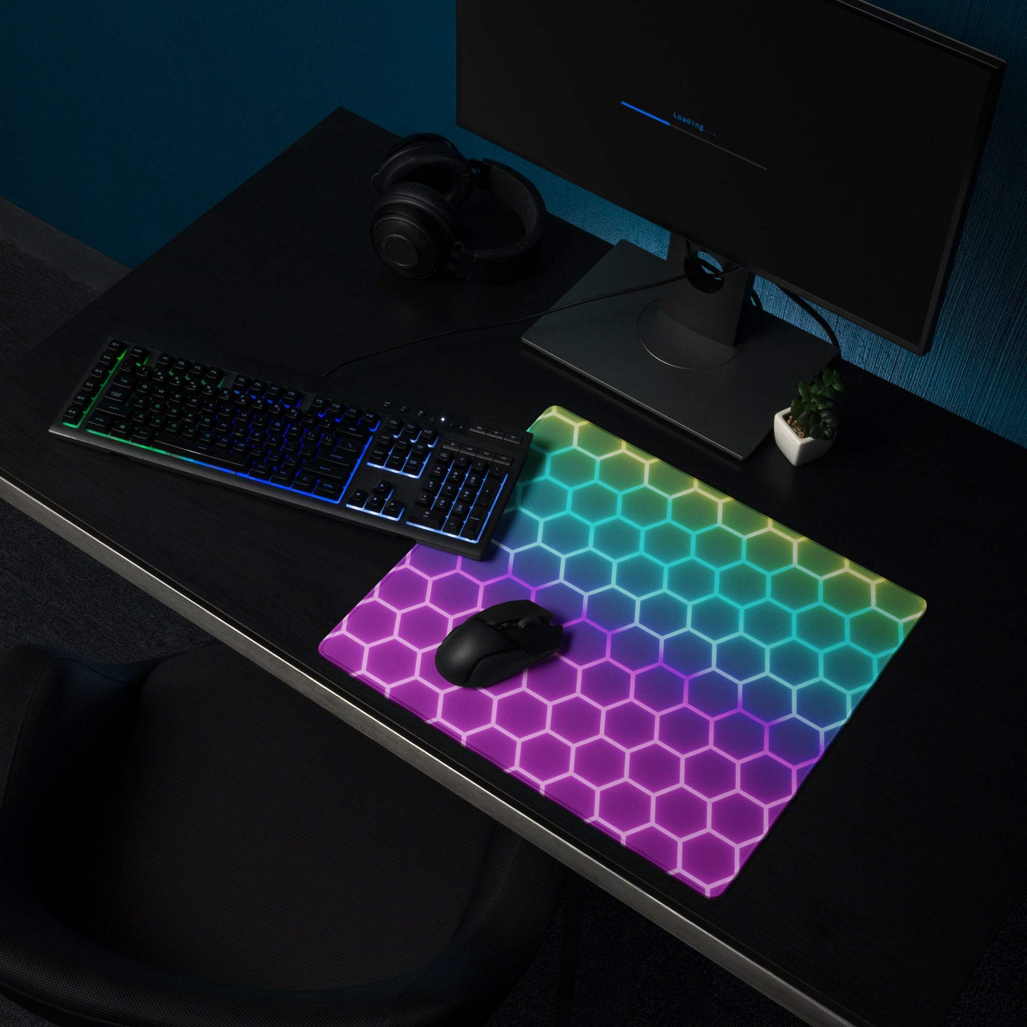 Vibrant rainbow hexagon RGB gaming mouse pad with non-slip base