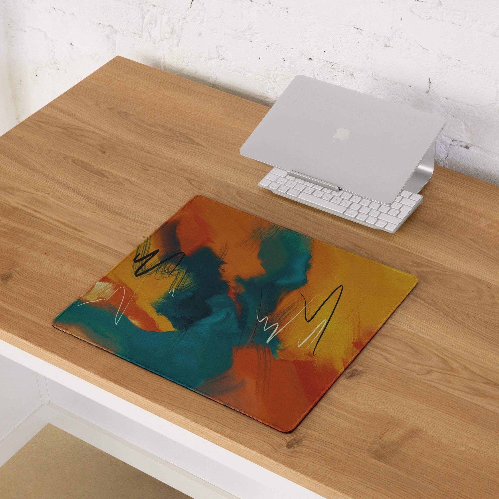 Large abstract art gaming mouse pad with orange teal swirls, non-slip base, stitched edges