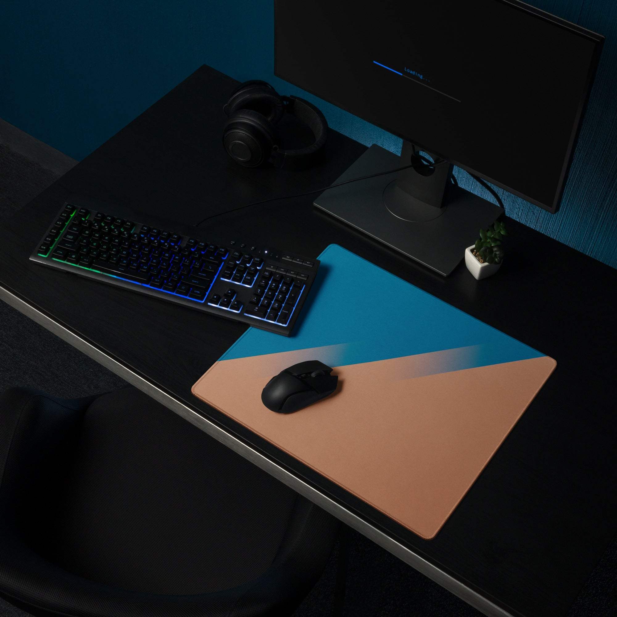Blue and tan geometric gaming mousepad with black wireless mouse