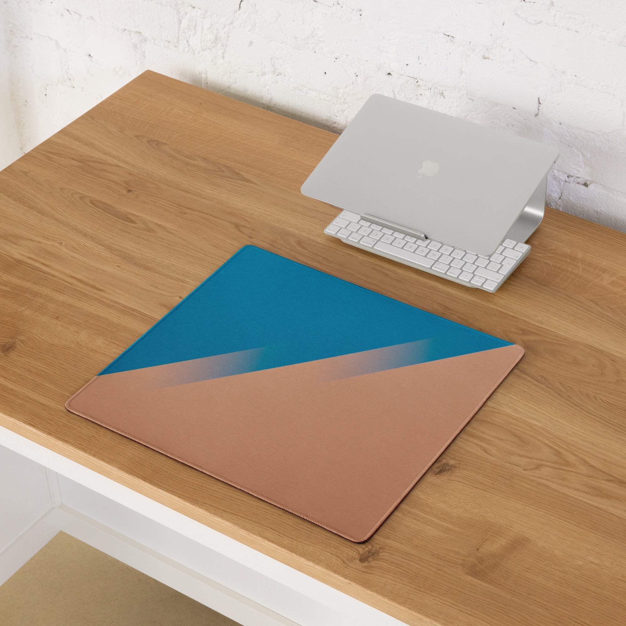 Sleek teal to rose gold gradient laptop stand mat with non-slip backing
