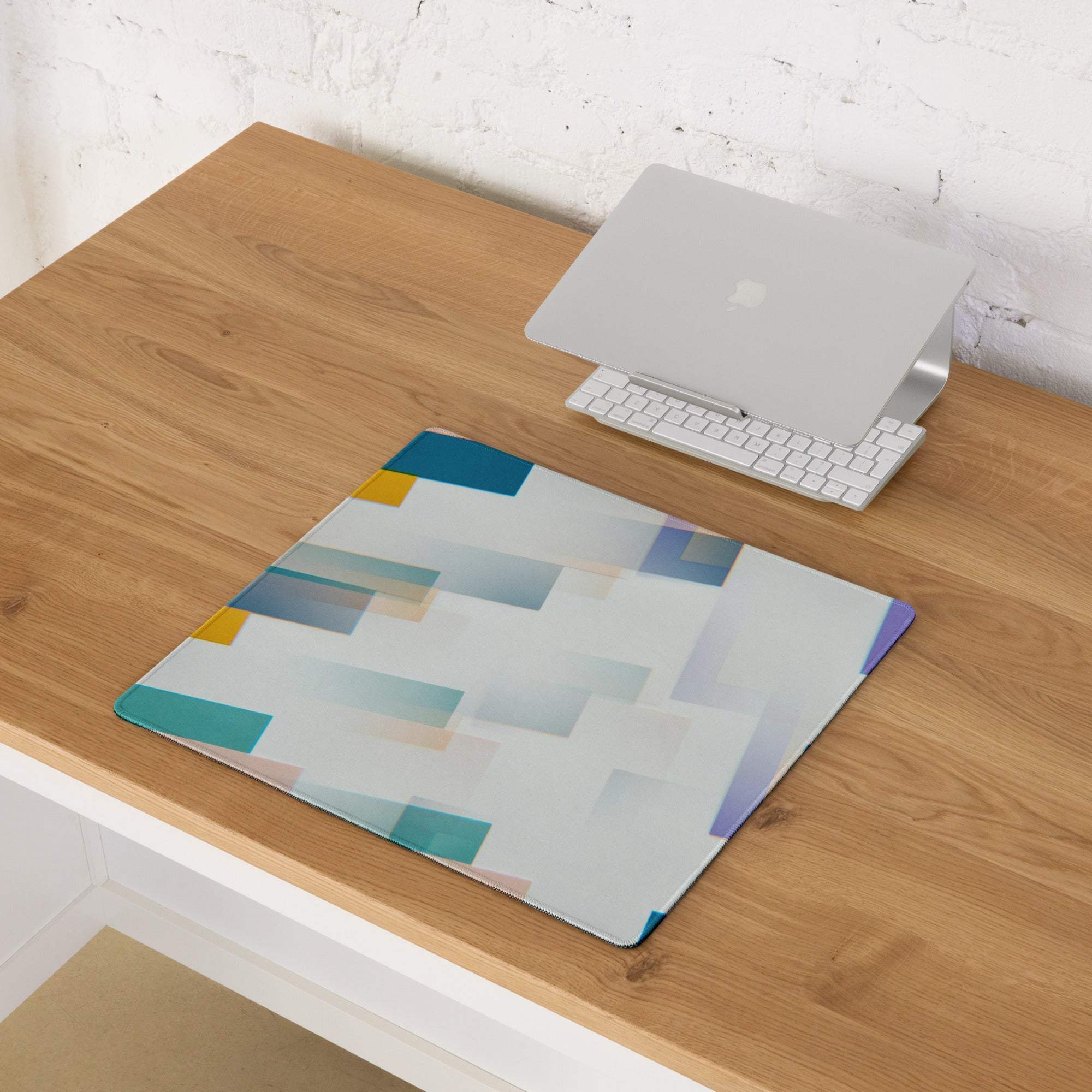 Large colorful abstract geometric gaming mouse pad with teal yellow blocks non-slip base