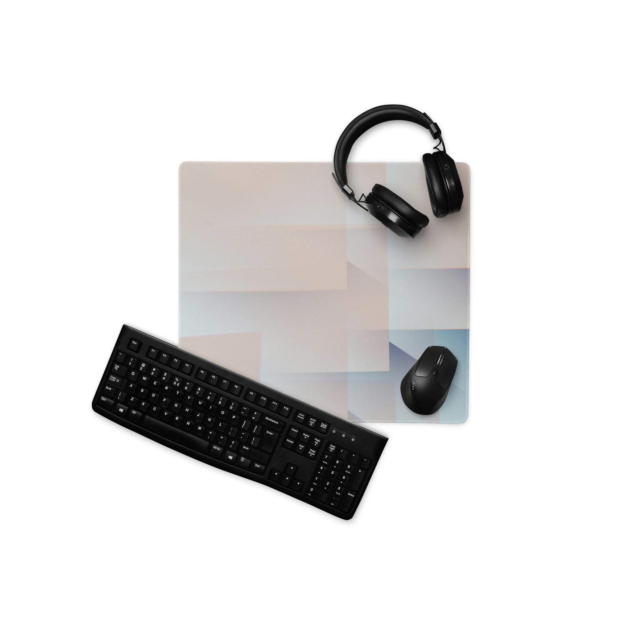 Black wireless keyboard on pastel geometric gaming mouse pad