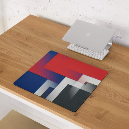 Geometric gaming mouse pad with bold red blue black gradients, non-slip backing