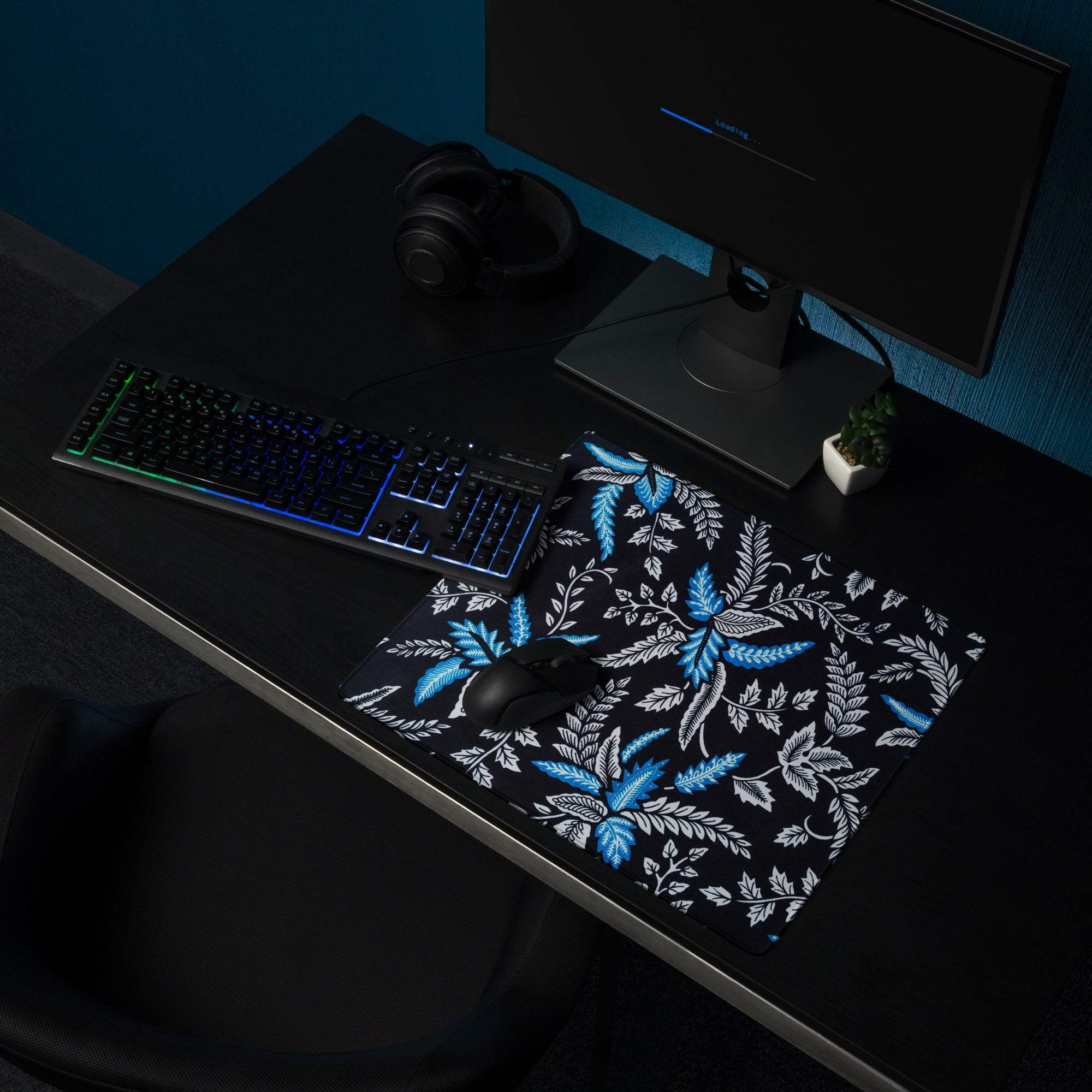 Large modern botanical leaves gaming mouse pad with blue white pattern on black non-slip stitched base