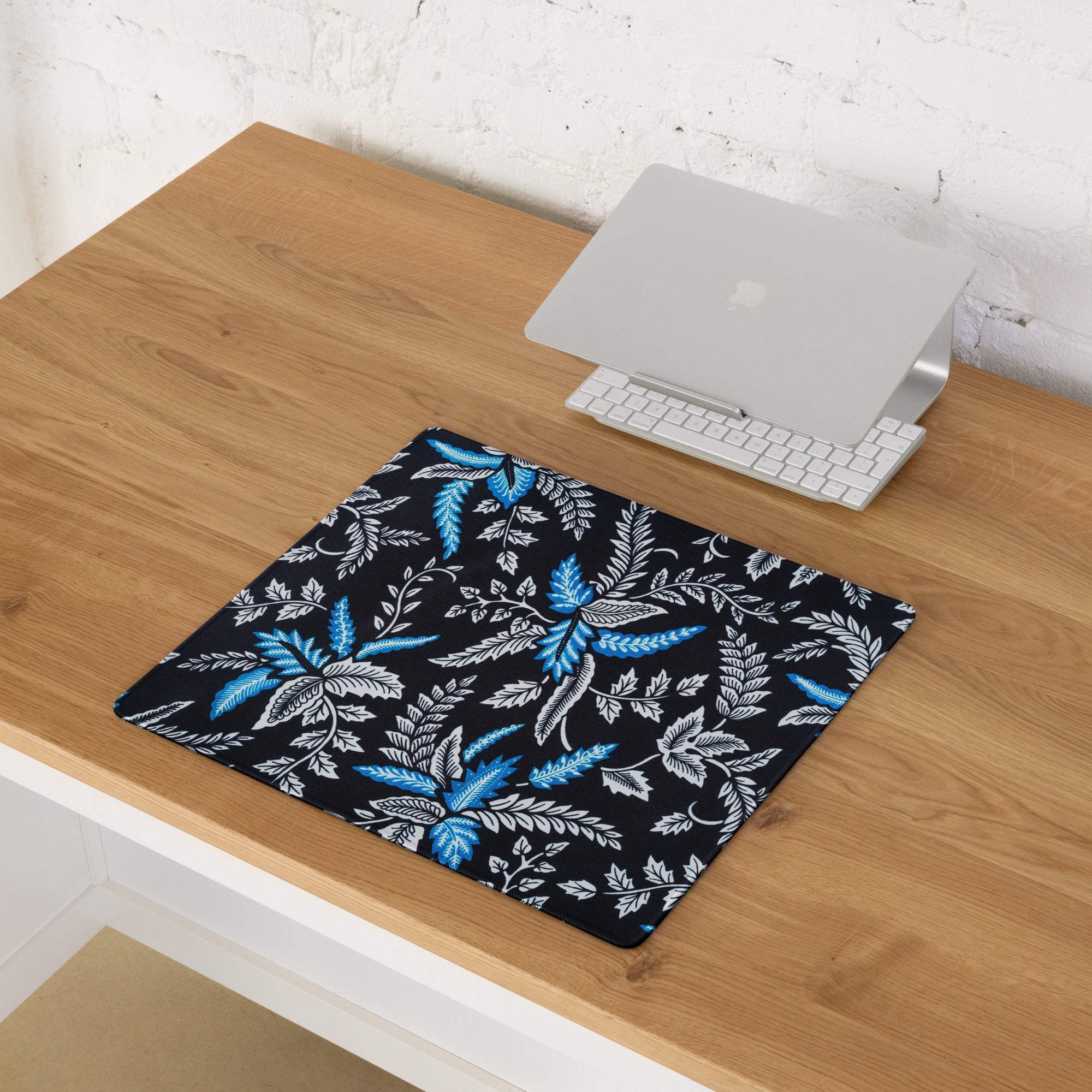 Black mousepad with vibrant blue white fern pattern, large non-slip gaming pad