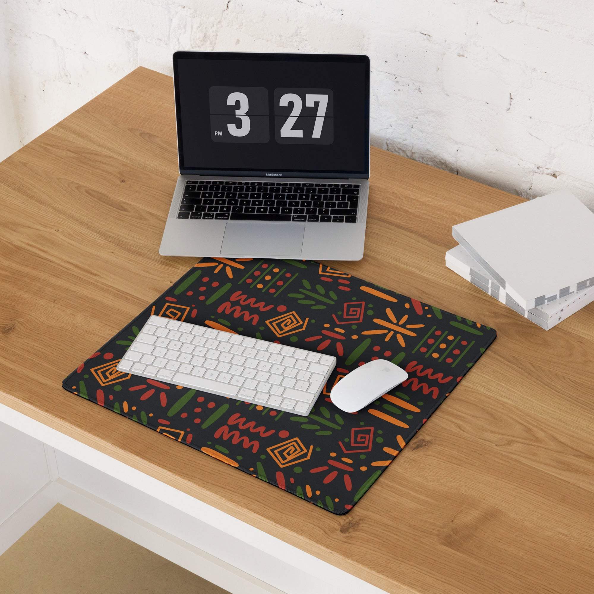 Black gaming mouse pad with orange green geometric floral patterns, non-slip backing