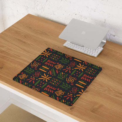 Black gaming mouse pad with vibrant orange green geometric botanical pattern
