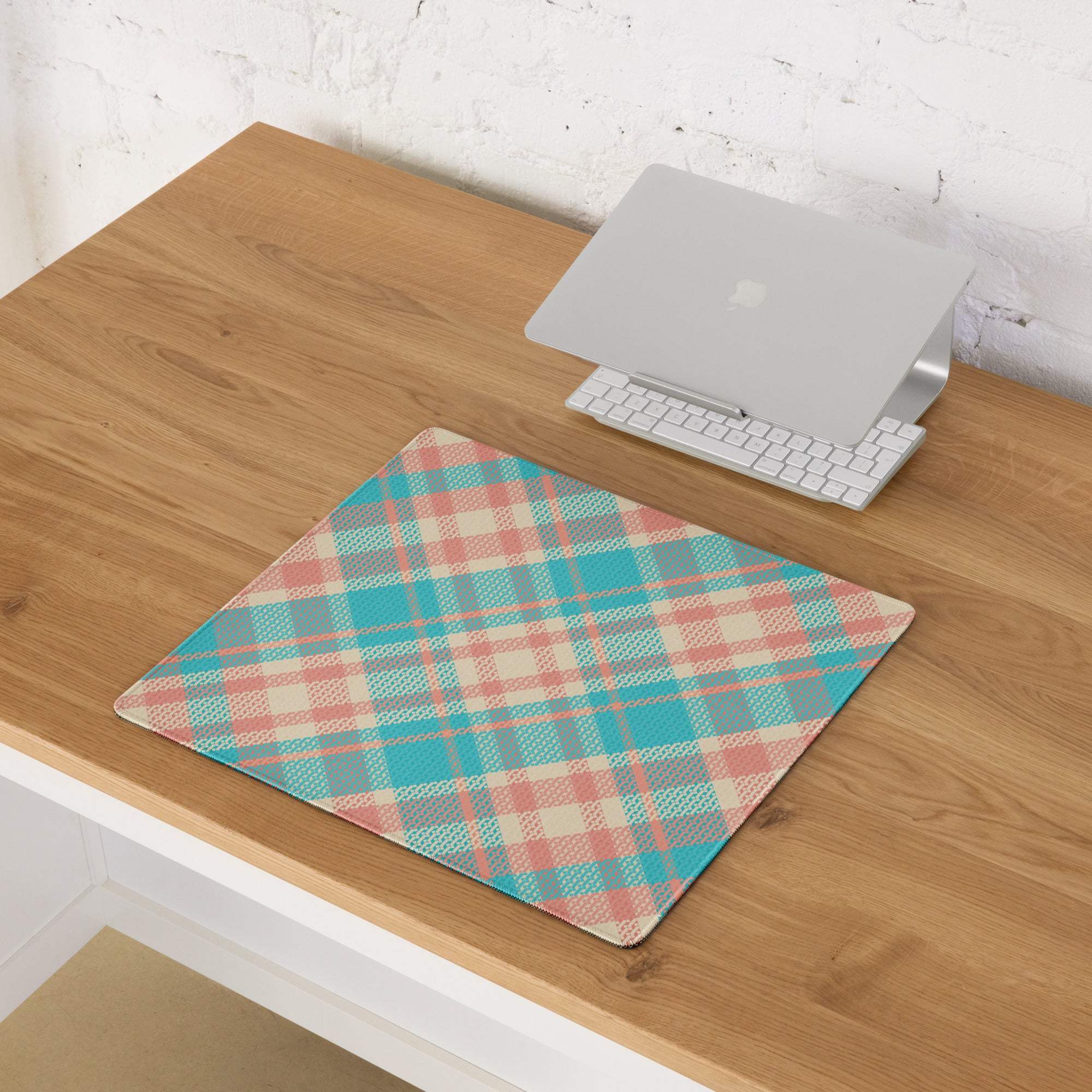 Vibrant teal peach plaid gaming mouse pad with non-slip base