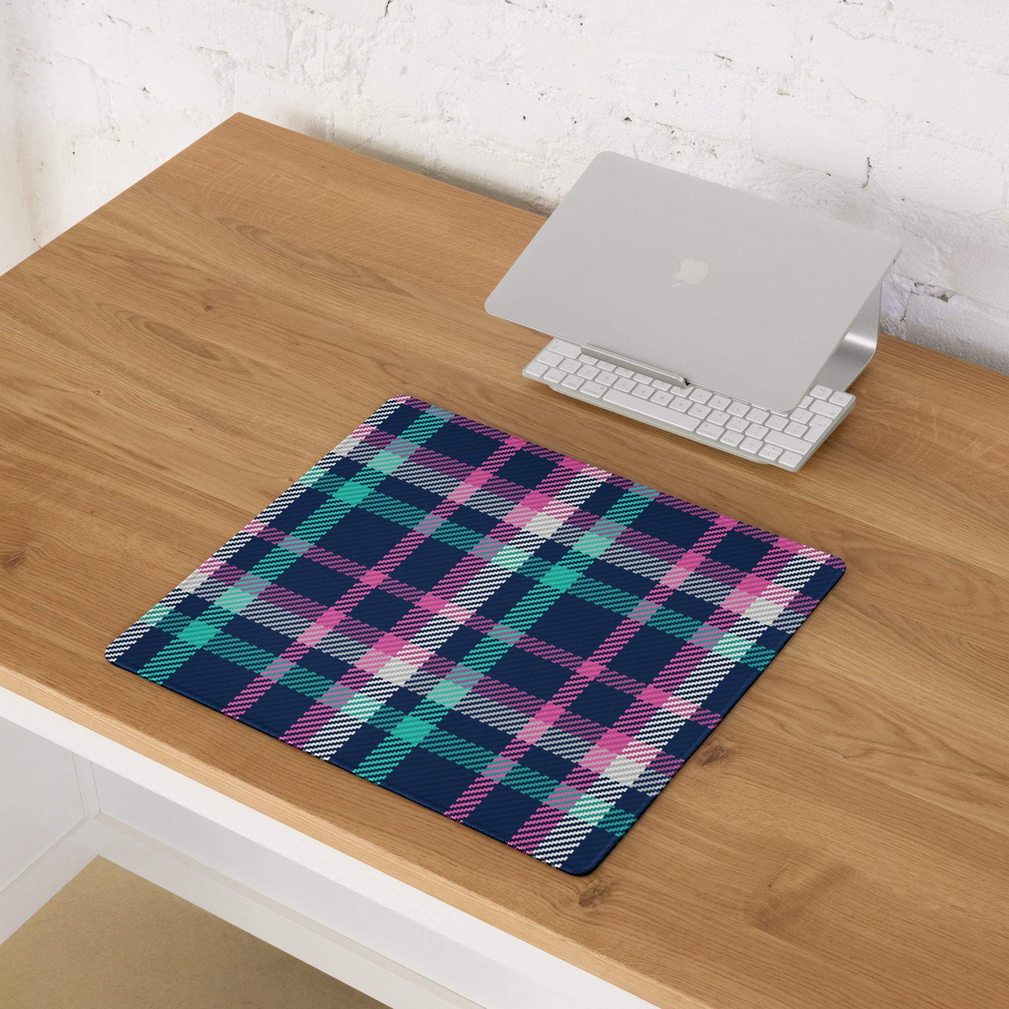 Vibrant pink navy teal plaid gaming mouse pad with non-slip base