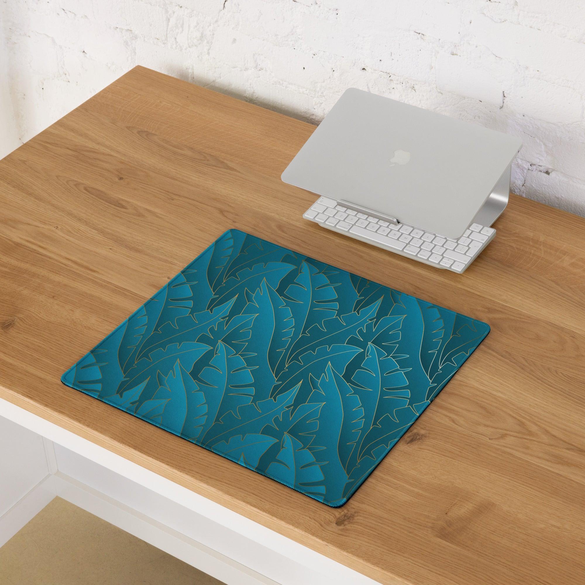 Teal tropical leaf blue gaming mouse pad with non-slip base