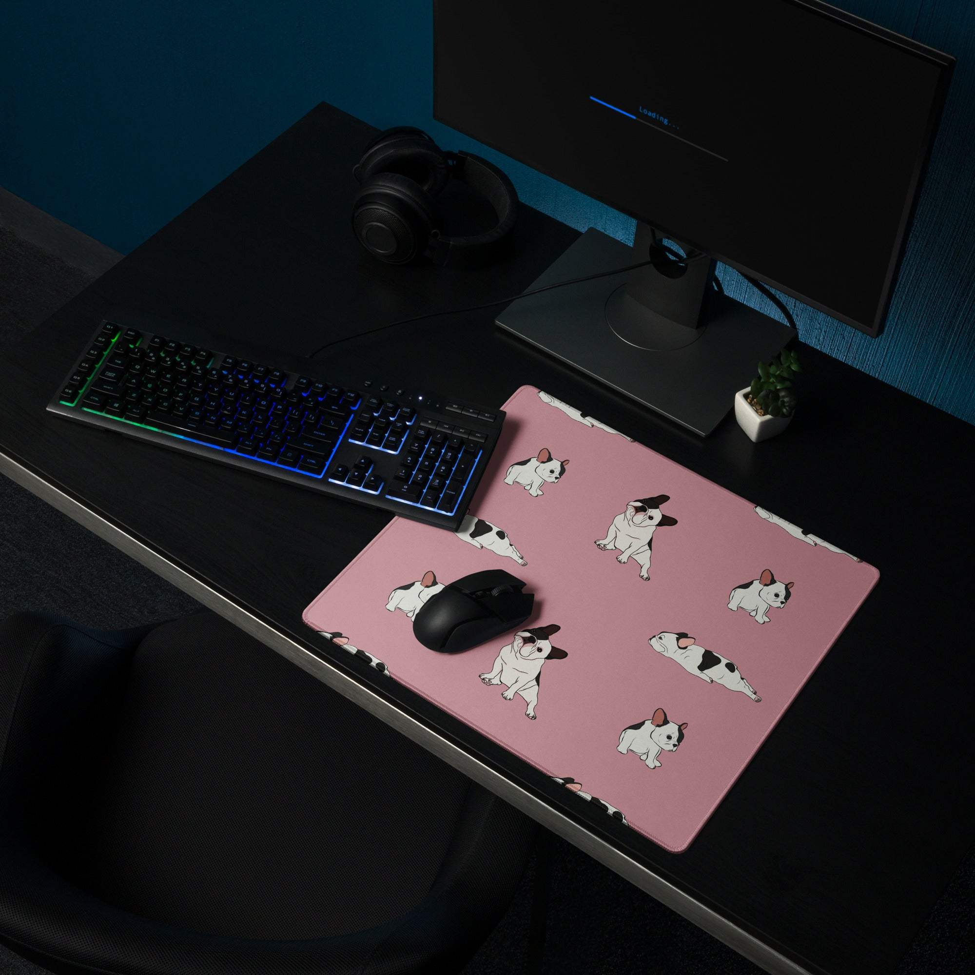 Pink mousepad with repeating black and white cartoon French bulldog pattern