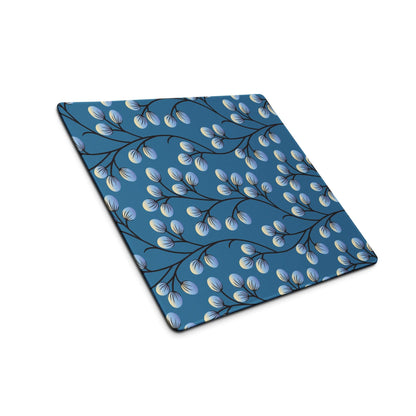 Blue gaming mouse pad with black branches and light blue oval buds pattern