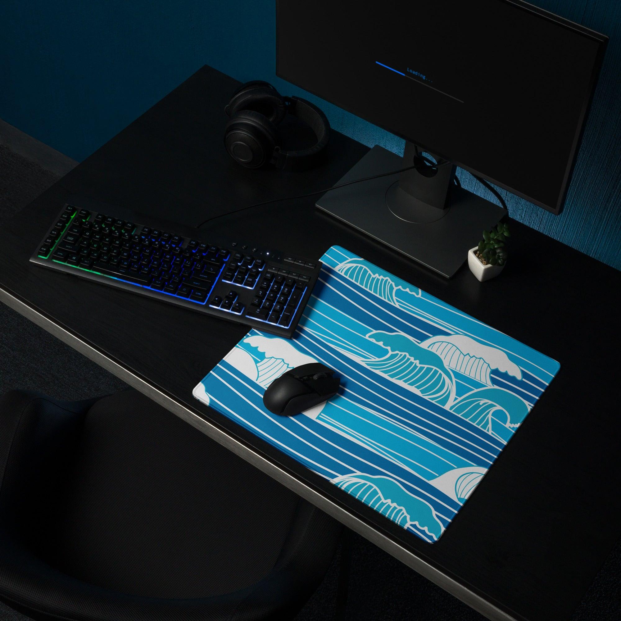 Blue wave-patterned gaming mouse pad with white teal accents non-slip surface