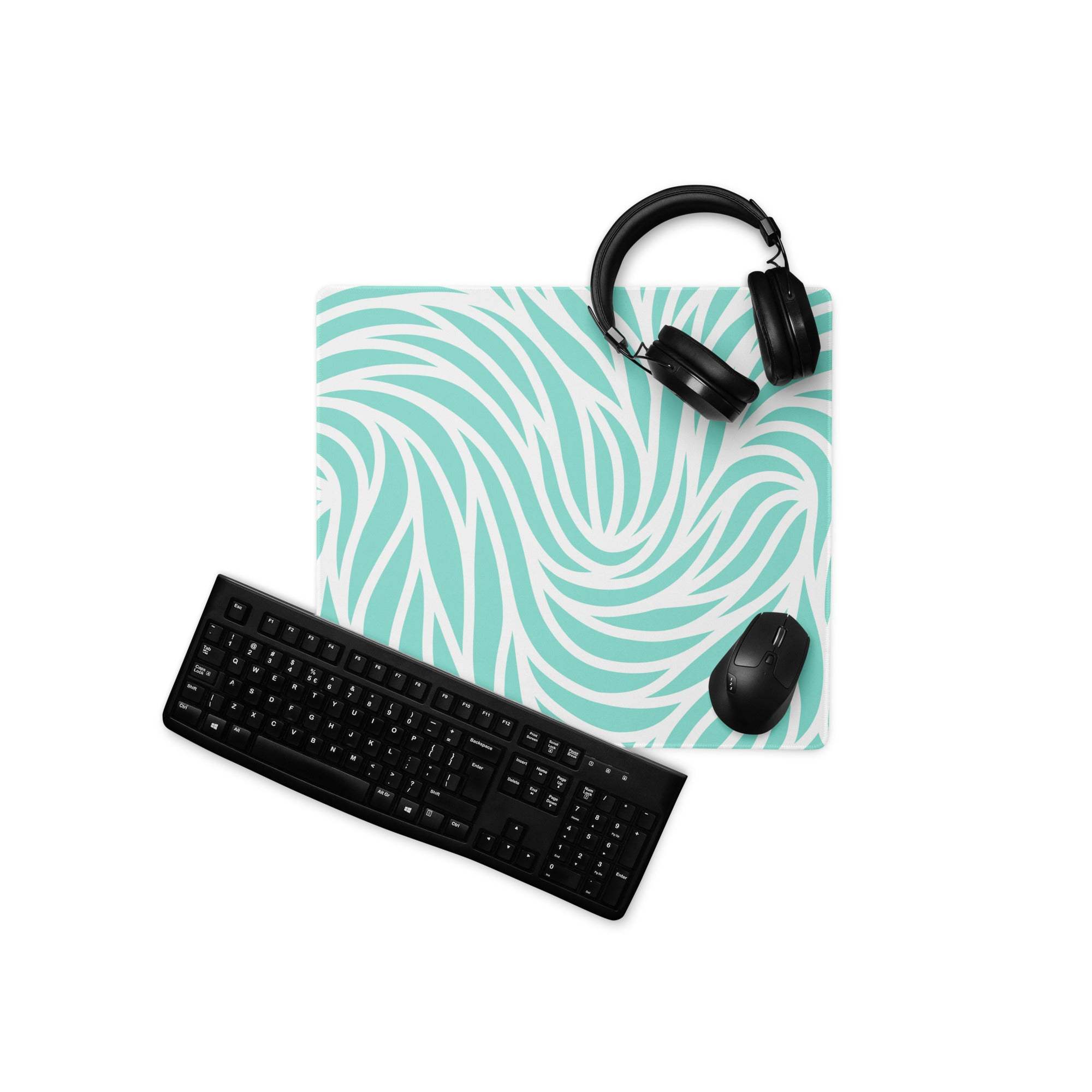 Vibrant turquoise wave gaming mouse pad with black headphones on top