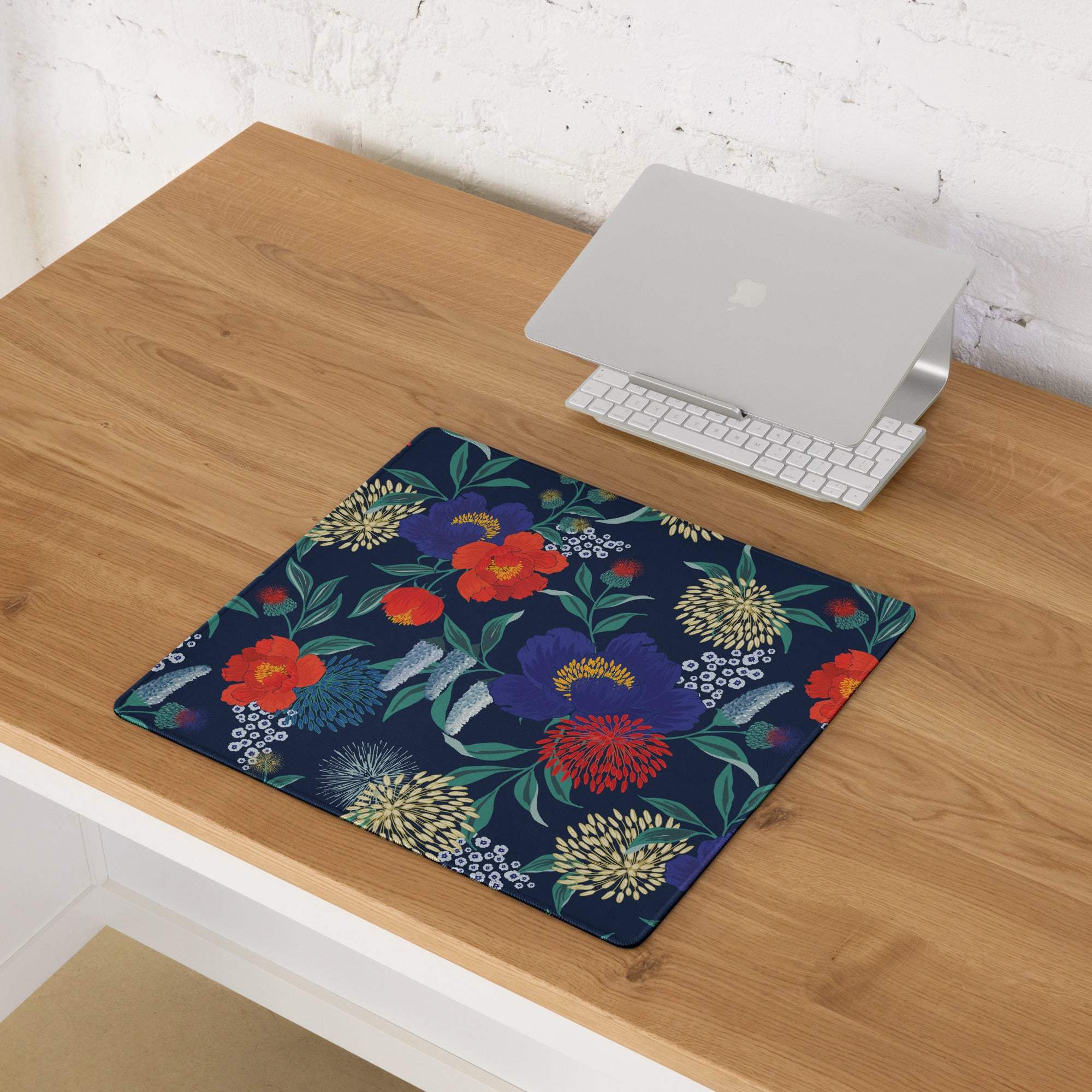 Floral navy blue gaming mouse pad with vibrant red purple blossoms, stitched edges, non-slip base