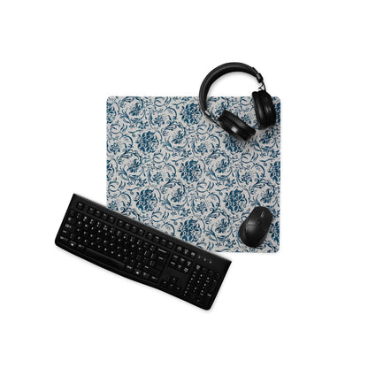 Blue floral gaming mousepad with black keyboard and headphones
