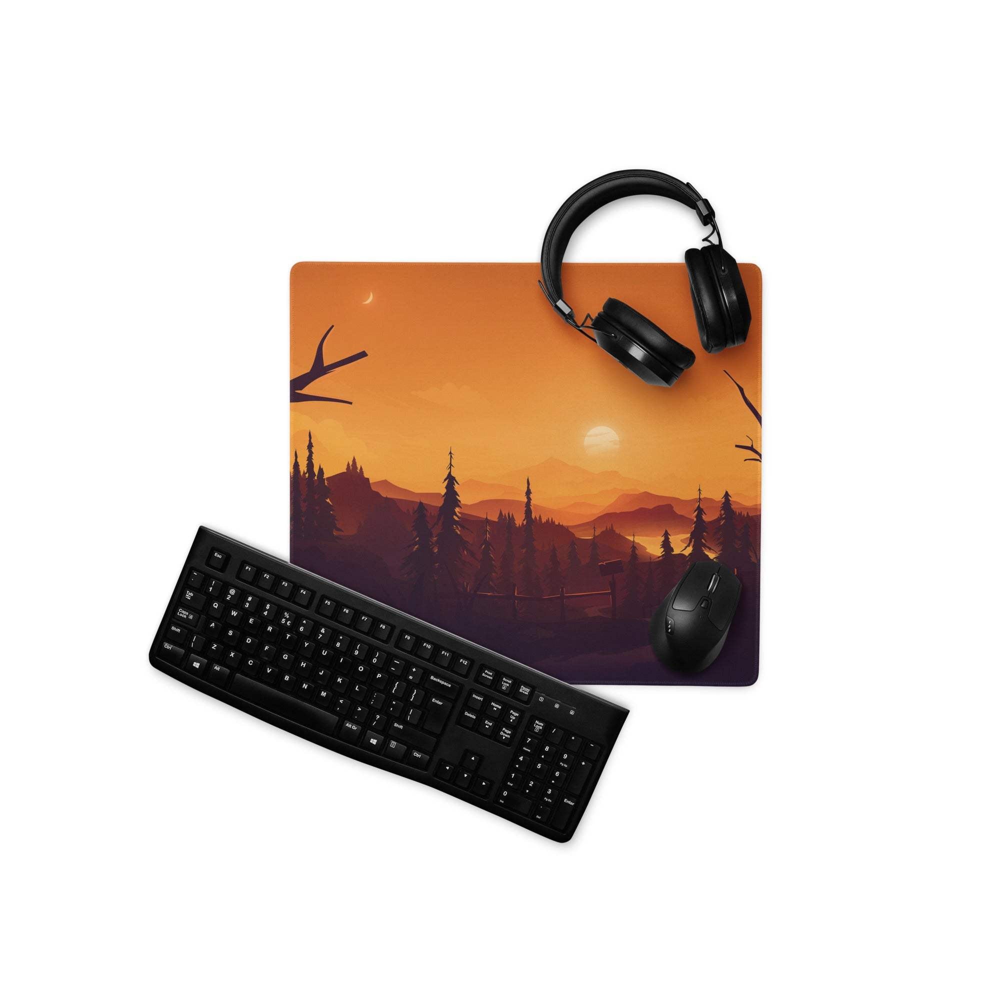 Bold sunset forest large gaming mouse pad with orange purple design, black headphones on top