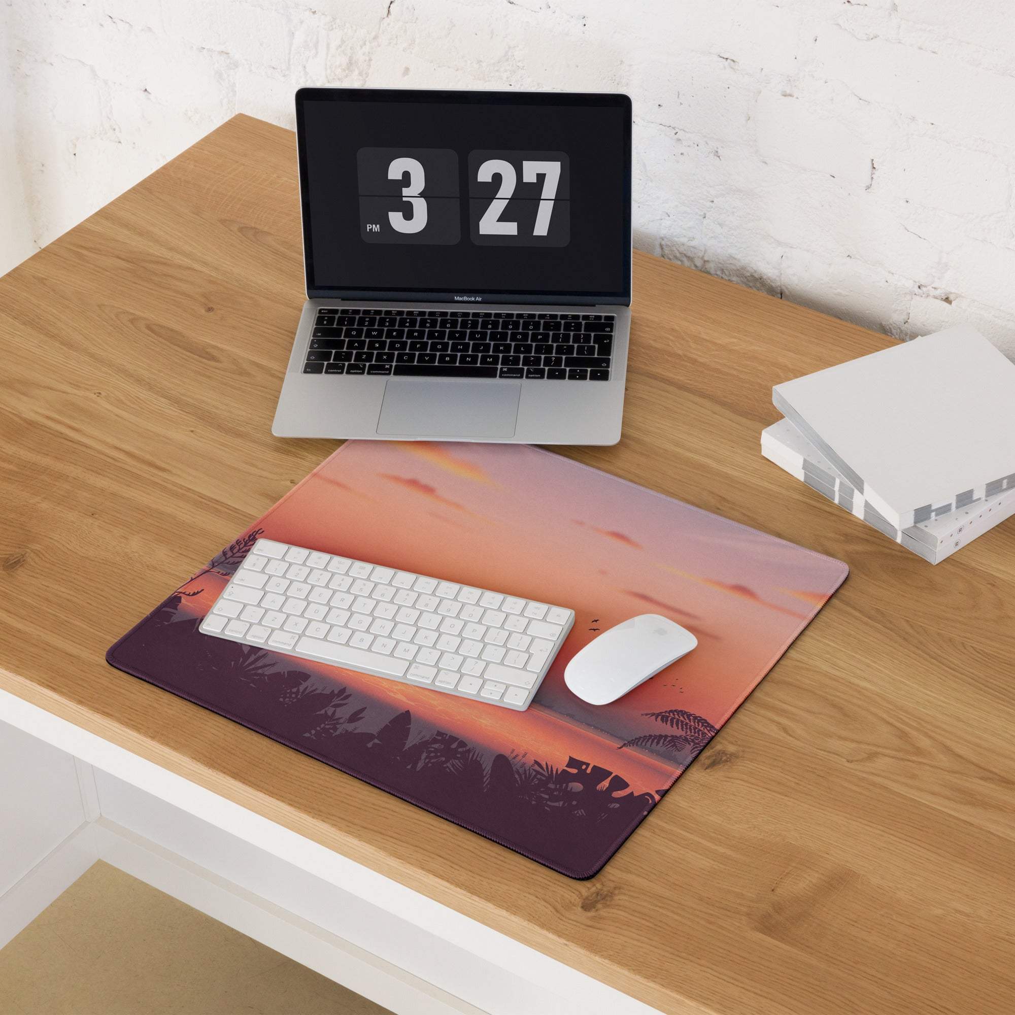 Sunset tropical large gaming mouse pad with orange pink purple hues over silhouetted trees