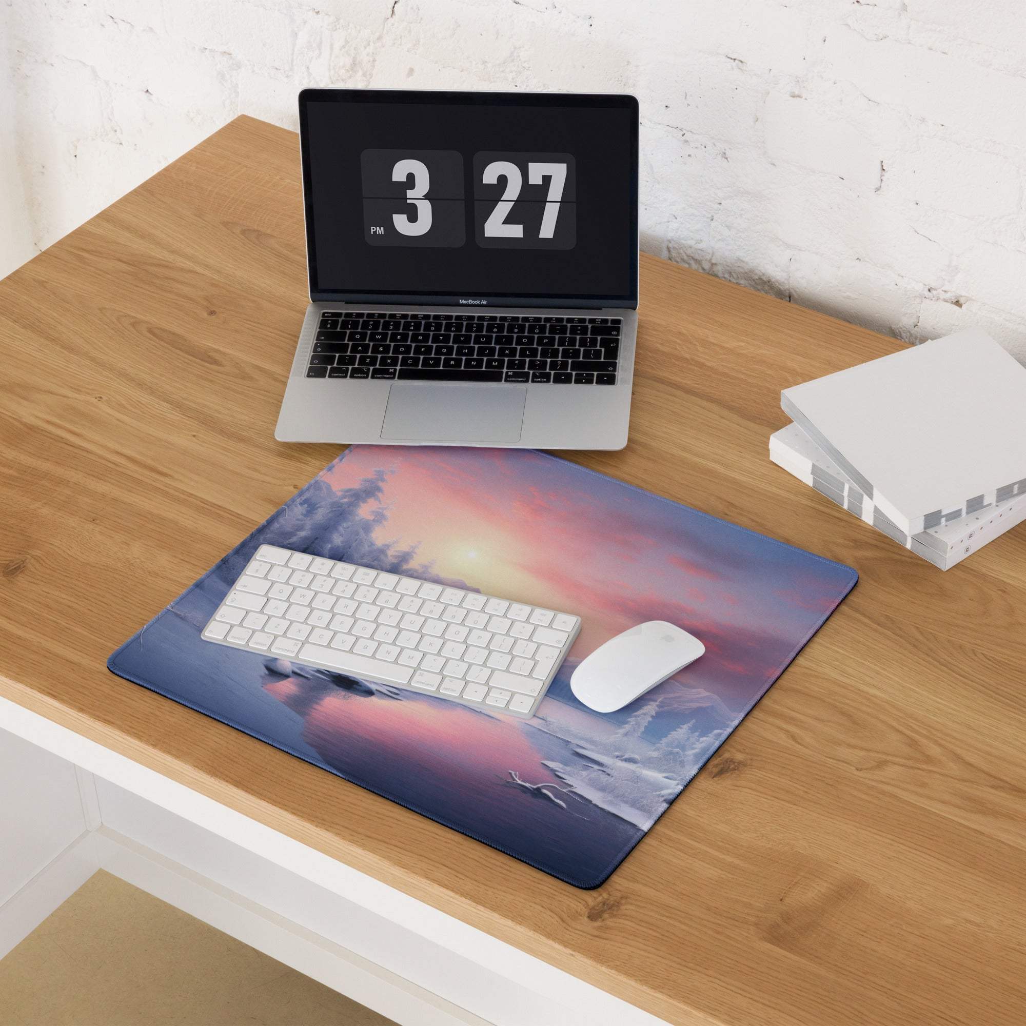 Winter snowy forest sunset mousepad with vibrant pink orange hues over water