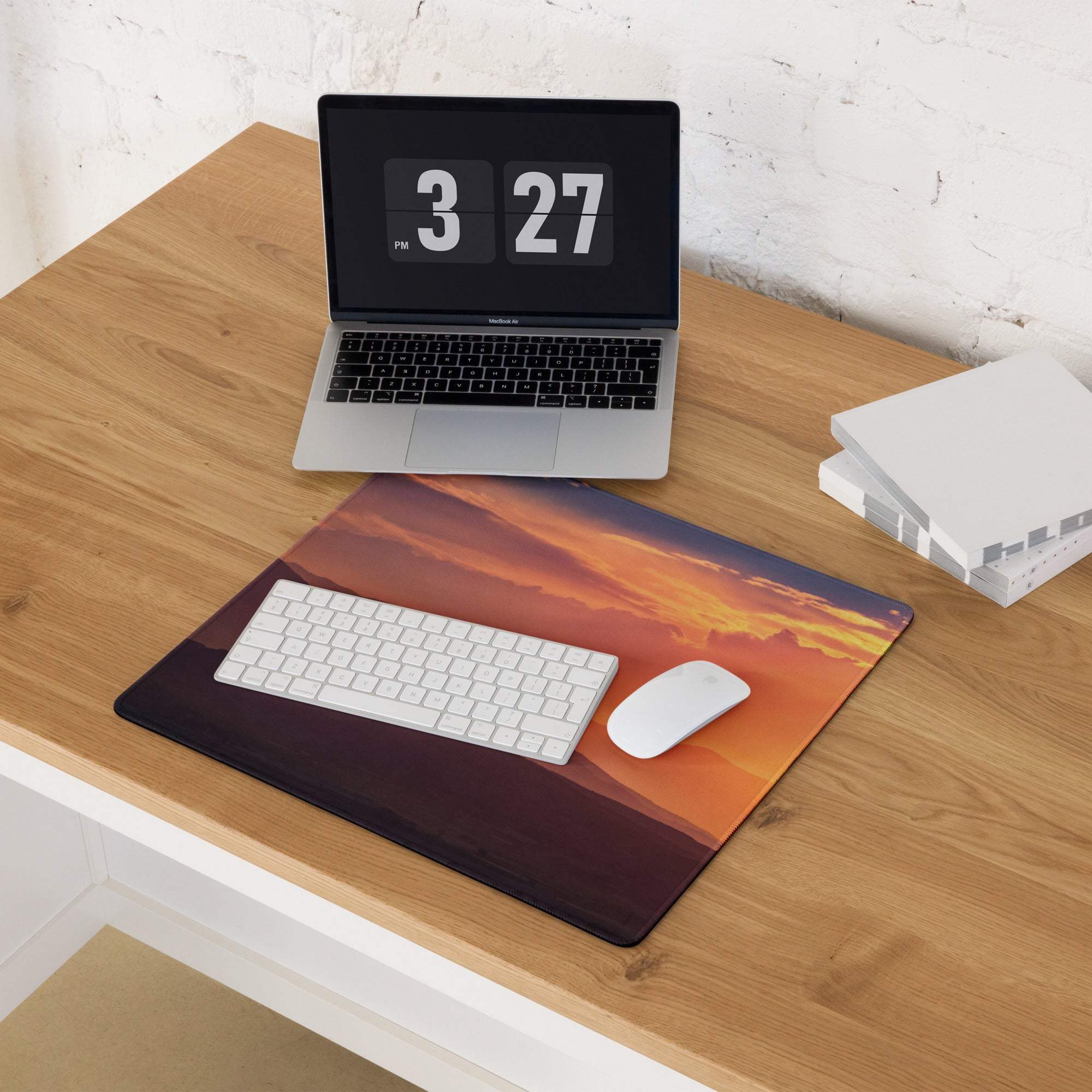 Sunset mountain landscape gaming mouse pad with vibrant orange hues and non-slip base