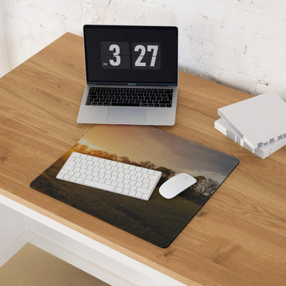 Golden Hour Sunset gaming mouse pad with silhouetted trees on wood desk