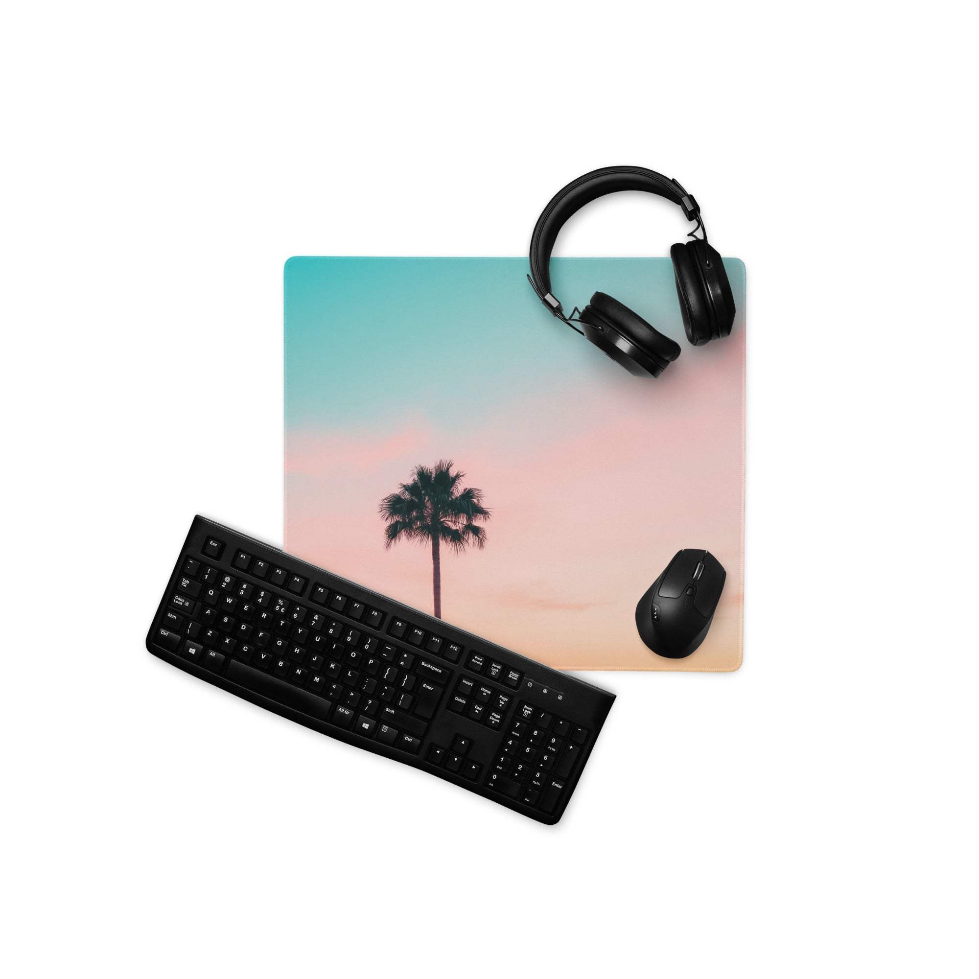 Large pastel sunset palm tree gaming mouse pad with teal to pink gradient and non-slip desk mat design