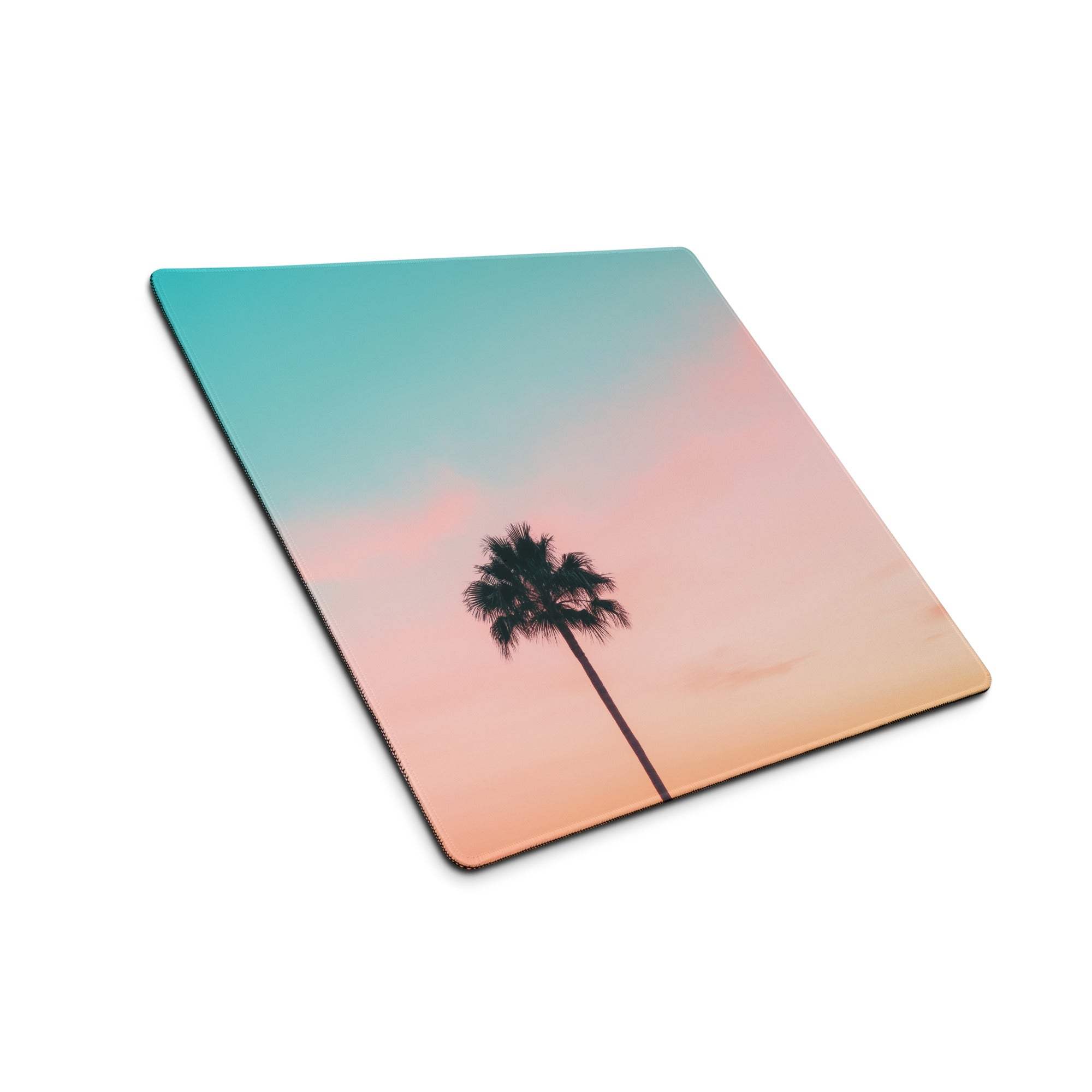 Large pastel sunset palm tree gaming mouse pad with teal-to-peach gradient sky