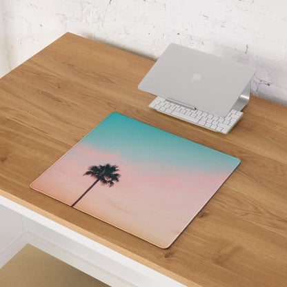Large pastel sunset palm tree gaming mouse pad with teal-to-pink gradient sky and non-slip desk mat design
