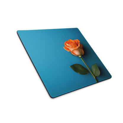 Elegant blue gaming mouse pad with orange rose design and non-slip backing